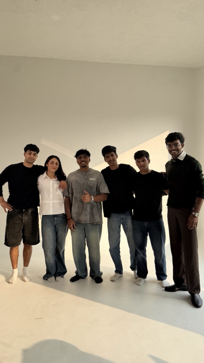 the team, lined up in the studio
